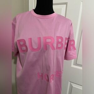 Burberry t-shirt in pink with large logo on the front, and black of the shirt.